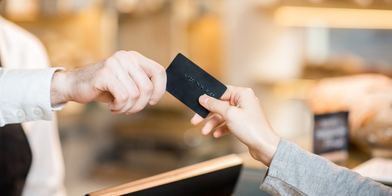 Paying by credit card in the store with bakery products